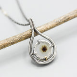 A garden Dendritic quartz pendant necklace in sterling silver bezel and prongs setting with silver vine design on sterling silver chain