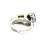 Oval faceted garnet ring in silver bezel and double prongs setting with green tourmaline on the side on sterling silver hammer texture band