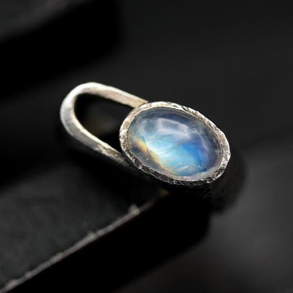 Oval cabochon Moonstone ring in signet style with sterling silver textured oxidized band