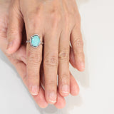 Oval turquoise ring in silver bezel and prongs setting with sterling silver oxidized hammer texture band