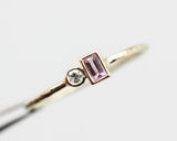 Baguette pink sapphire and diamond ring in bezel setting with 14k gold texture band
