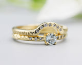 Set of 2 Round faceted blue topaz ring with tiny diamonds on 14k gold band set with 14k gold band ring with tiny 7 diamond on the center