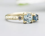 14k gold wedding ring with blue topaz, blue sapphire, diamond gemstone in bezel and prongs setting