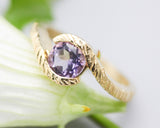 Bypass style ring 14k gold line texture design with round faceted Amethyst at the center