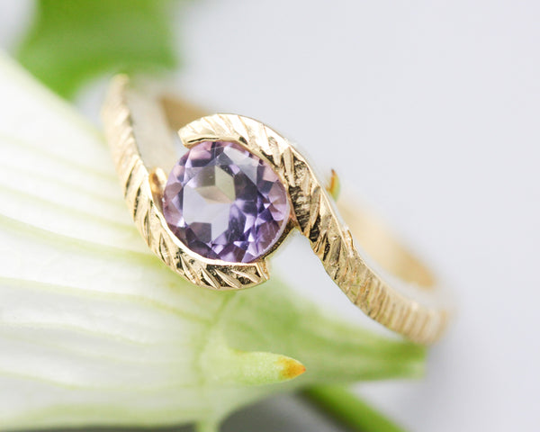 Bypass style ring 14k gold line texture design with round faceted Amethyst at the center