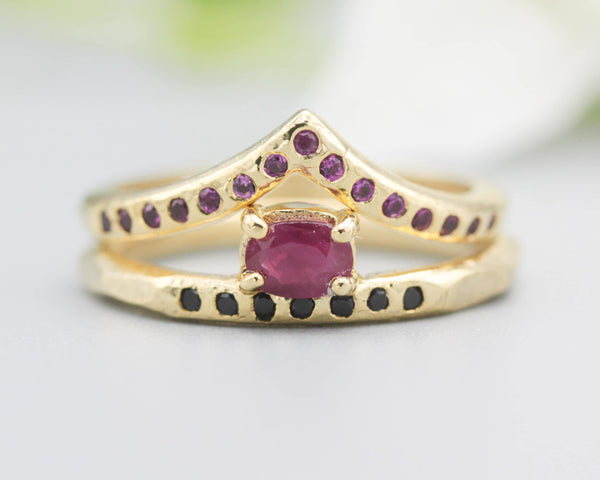 Set of 2 Oval faceted ruby ring in prongs setting with tiny black spinel on 14k gold band set with 14k gold band ring and tiny 15 ruby