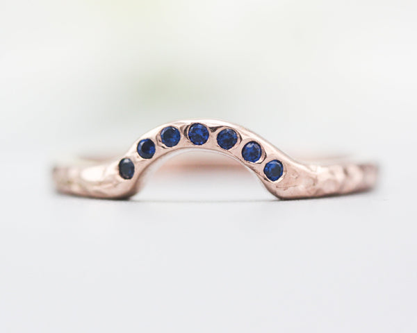 14k rose gold with hammer texture design band ring with tiny 7 blue sapphire on the center