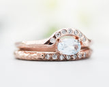 Set of 2 Oval faceted blue topaz ring with tiny diamonds on 14k Rose gold band set with 14k rose gold ring with 7 diamond on the center