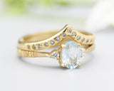Set of 2 Oval Blue topaz ring and diamond side set in prongs setting with 14k gold band set with 14k gold band ring and tiny 15 diamond