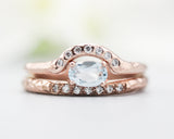 Set of 2 Oval faceted blue topaz ring with tiny diamonds on 14k Rose gold band set with 14k rose gold ring with 7 diamond on the center