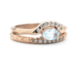 Set of 2 Oval faceted blue topaz ring with tiny diamonds on 14k Rose gold band set with 14k rose gold ring with 7 diamond on the center