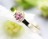 Round pink tourmaline ring in pave setting with 14k gold high polished flat band