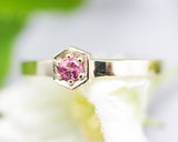 Round pink tourmaline ring in pave setting with 14k gold high polished flat band