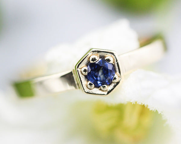 Blue sapphire ring in pave setting with 14k gold high polished flat band