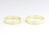 Set of his and her wedding bands ring in 18k gold in wood design texture