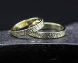 Set of his and her wedding bands ring in 18k gold in wood design texture
