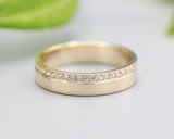 14k gold wedding ring 4 mm with diamond that extends half of the way around the high polished band