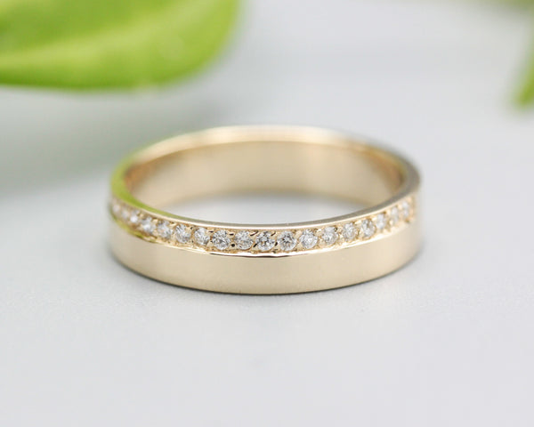 14k gold wedding ring 4 mm with diamond that extends half of the way around the high polished band