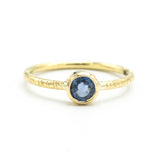 Round cut Blue sapphire ring in bezel settings with 18k gold texture band