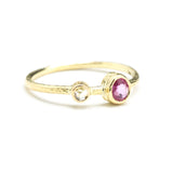 Oval ruby ring in bezel setting and tiny diamond with 18k gold texture band