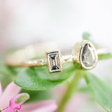 Teardrop diamond ring and rectangle diamond in bezel setting with 18k gold texture band