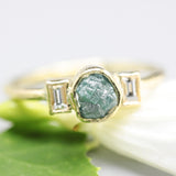 Rough diamond ring and twin side set diamonds with 18k gold texture band
