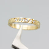 Tiny diamond eternity ring with 18k yellow gold band