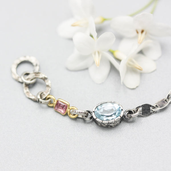 Oval Blue topaz pendant bracelet with pink sapphire gemstone on sterling silver chain