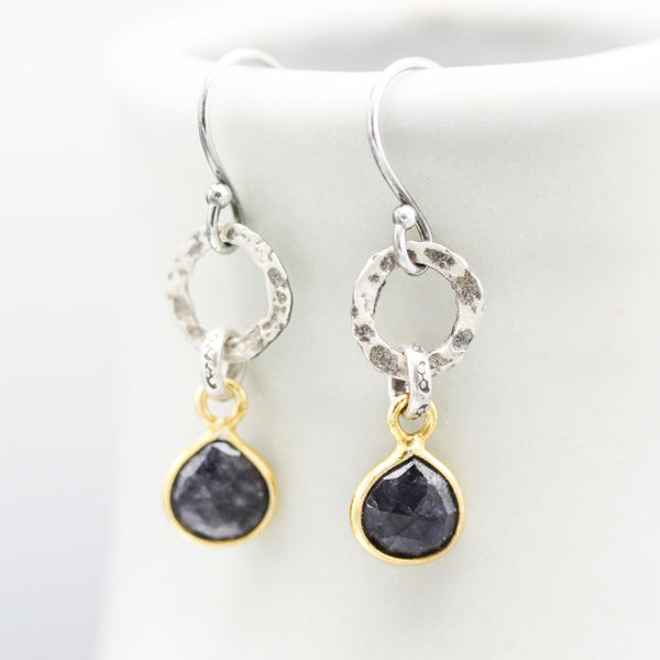 Teardrop faceted blue sapphire earrings in silver bezel setting with silver circle shape and hooks style on the top