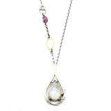 Moonstone teardrop cabochon pendant necklace in silver bezel and prongs setting with silver vine design and pink sapphire gemstone secondary