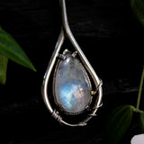 Moonstone teardrop cabochon pendant necklace in silver bezel and prongs setting with silver vine design and pink sapphire gemstone secondary