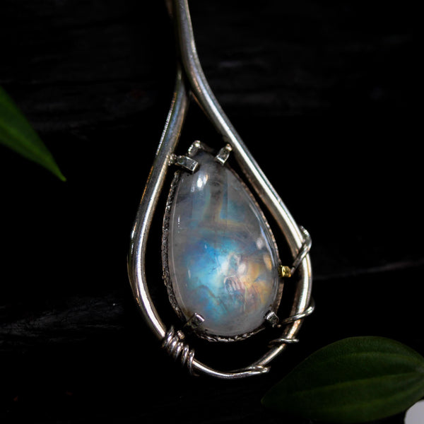 Moonstone teardrop cabochon pendant necklace in silver bezel and prongs setting with silver vine design and pink sapphire gemstone secondary