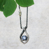 Silver fish shape necklace and cabochon star blue sapphire at the center with aquamarine beads secondary on oxidized sterling silver chain - Metal Studio Jewelry