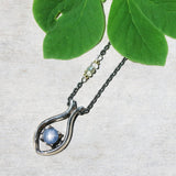Silver fish shape necklace and cabochon star blue sapphire at the center with aquamarine beads secondary on oxidized sterling silver chain - Metal Studio Jewelry