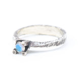 Tiny round faceted moonstone ring in silver prongs setting with sterling silver hard texture oxidized band - Metal Studio Jewelry