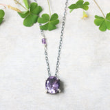 Oval Amethyst pendant necklace in silver bezel and prongs setting with amethyst beads secondary on oxidized sterling silver chain - Metal Studio Jewelry