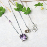 Oval Amethyst pendant necklace in silver bezel and prongs setting with amethyst beads secondary on oxidized sterling silver chain - Metal Studio Jewelry