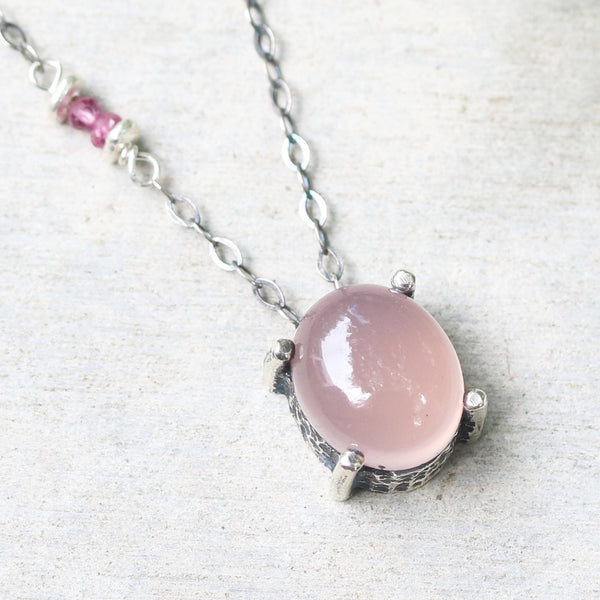 Oval cabochon rose quartz necklace in silver bezel and prongs setting with pink multi-sapphire beads secondary on oxidized silver chain - Metal Studio Jewelry