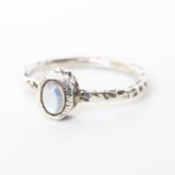 Dainty oval moonstone ring in silver bezel setting with oxidized texture sterling silver band - Metal Studio Jewelry