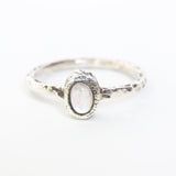 Dainty oval moonstone ring in silver bezel setting with oxidized texture sterling silver band - Metal Studio Jewelry