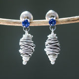 Sterling silver stud earrings with faceted blue sapphire in prongs setting with silver bird's nest - Metal Studio Jewelry