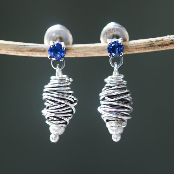 Sterling silver stud earrings with faceted blue sapphire in prongs setting with silver bird's nest - Metal Studio Jewelry