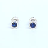 Sterling silver stud earrings with faceted blue sapphire in bezel setting with sterling silver post and backing - Metal Studio Jewelry