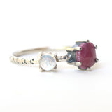 Faceted ruby ring in silver prongs setting and faceted moonstone with sterling silver texture band