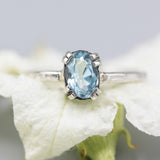 Oval Swiss blue topaz ring in silver bezel and prongs setting with sterling silver band - Metal Studio Jewelry