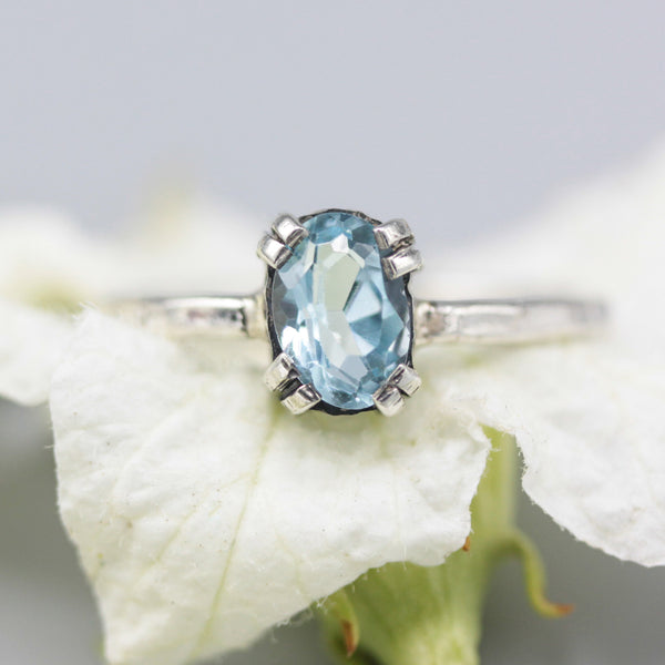 Oval Swiss blue topaz ring in silver bezel and prongs setting with sterling silver band - Metal Studio Jewelry
