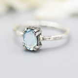 Oval Swiss blue topaz ring in silver bezel and prongs setting with sterling silver band - Metal Studio Jewelry