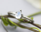 Teardrop faceted Moonstone ring in prongs setting with sterling silver oxidized texture band