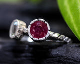 Round red ruby ring in silver bezel setting with blue topaz  sterling silver oxidized twist design band