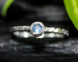 Round cabochon moonstone ring in bezel setting with sterling silver band